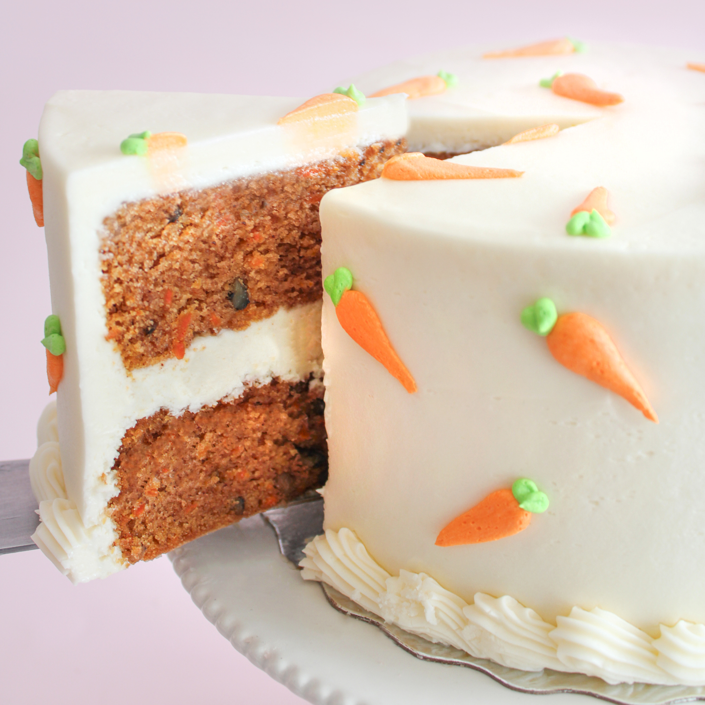 A slice of carrot cake with cream cheese icing
